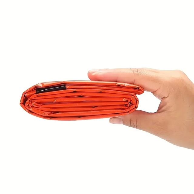 Extra-thick Mylar waterproof and windproof sleeping bag for emergencies, mountain hiking, camping, and survival. Increases body temperature up to 20°C.