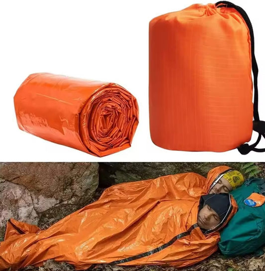 Extra-thick Mylar waterproof and windproof sleeping bag for emergencies, mountain hiking, camping, and survival. Increases body temperature up to 20°C.
